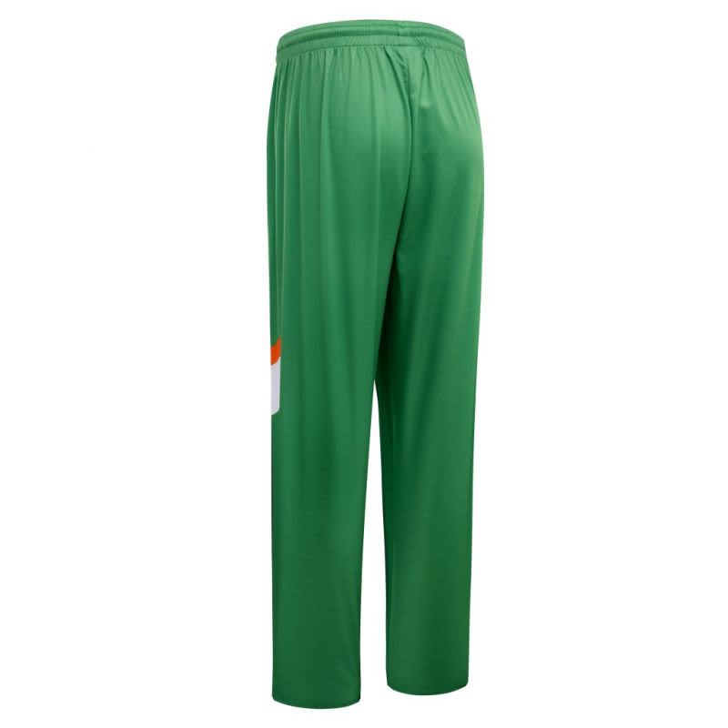 Green athletic pants with a loose fit and an orange accent. Features an elastic waistband and a logo.