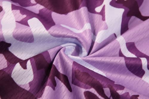 A fabric featuring a purple camouflage pattern, suitable for sports jerseys, with a smooth texture.