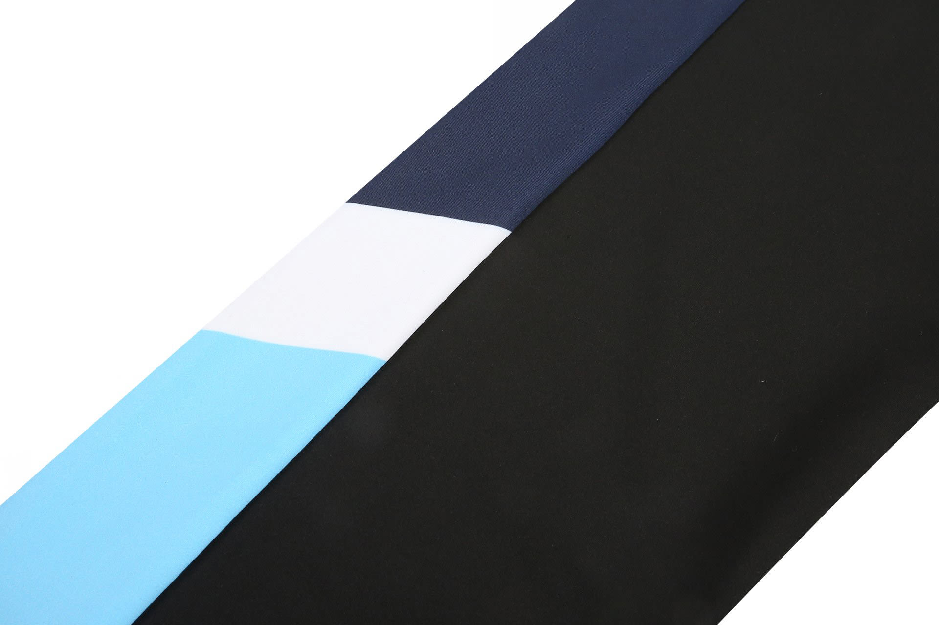 A selection of fabric in navy, black, and light blue with a logo, designed for a track suit warm-up.
