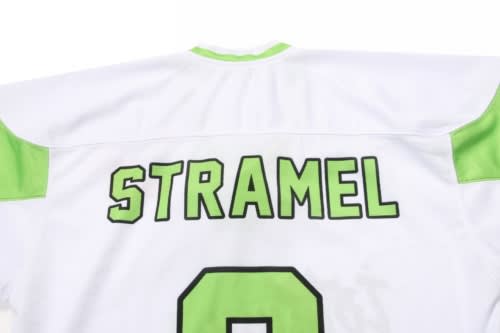 A white ice hockey racing suit featuring green accents and a name on the back. It has a logo as well.