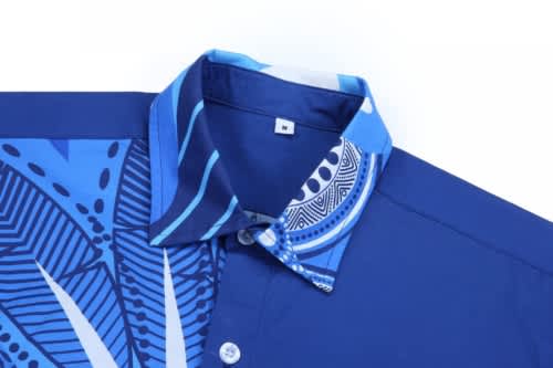 A blue cotton indigenous shirt featuring a patterned collar and sleeves, with a logo on the chest.
