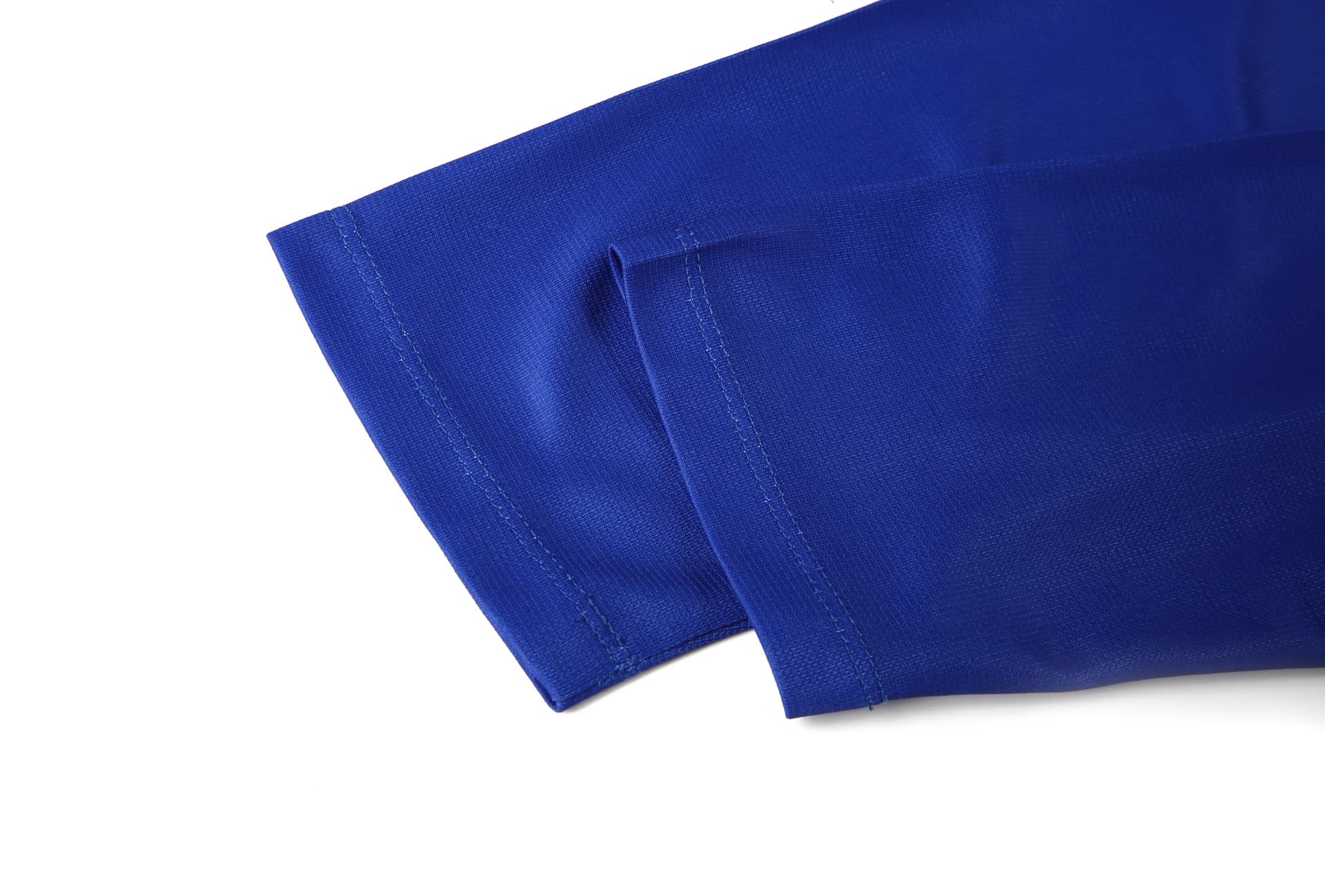 A blue lawn bowling uniform featuring sleeves with a smooth fabric texture and neat stitching.