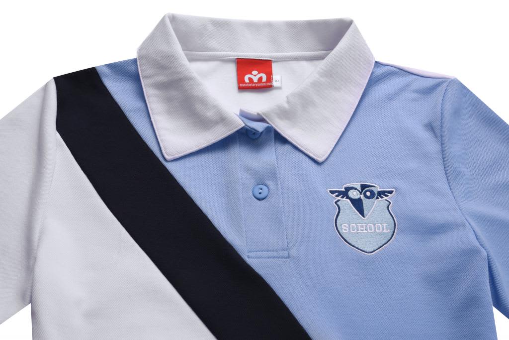 A girl's polo shirt in light blue, white, and black with a side stripe and an emblem. It features a collar and buttons.