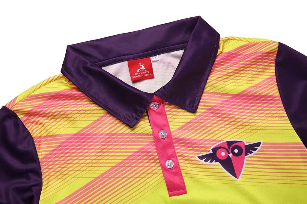 A fluorescent yellow and purple polo shirt with a logo on the front and a striped pattern on the body.