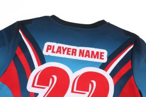 A sports jersey featuring a vibrant blue and red design, with a placeholder for a player name and number 22.