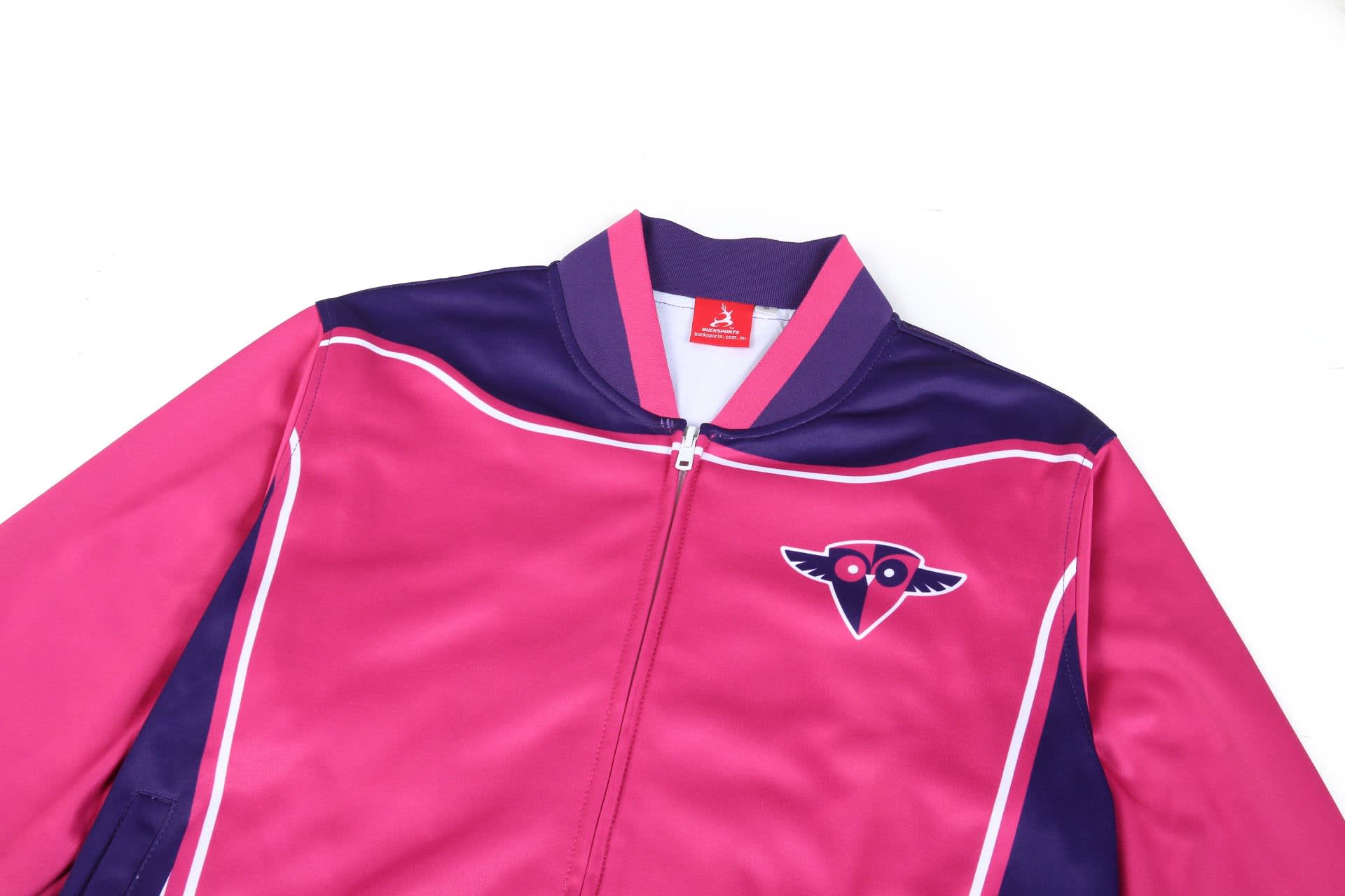 A pink and purple varsity jacket featuring a logo on the front and a zip-up closure.