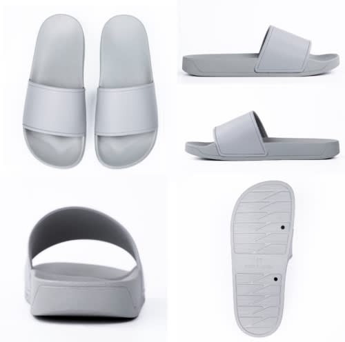 A pair of grey slippers with a wide strap, viewed from different angles, featuring a simple design and textured sole.