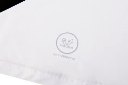 A white sports uniform featuring an anti-chlorine logo and contrasting black details.