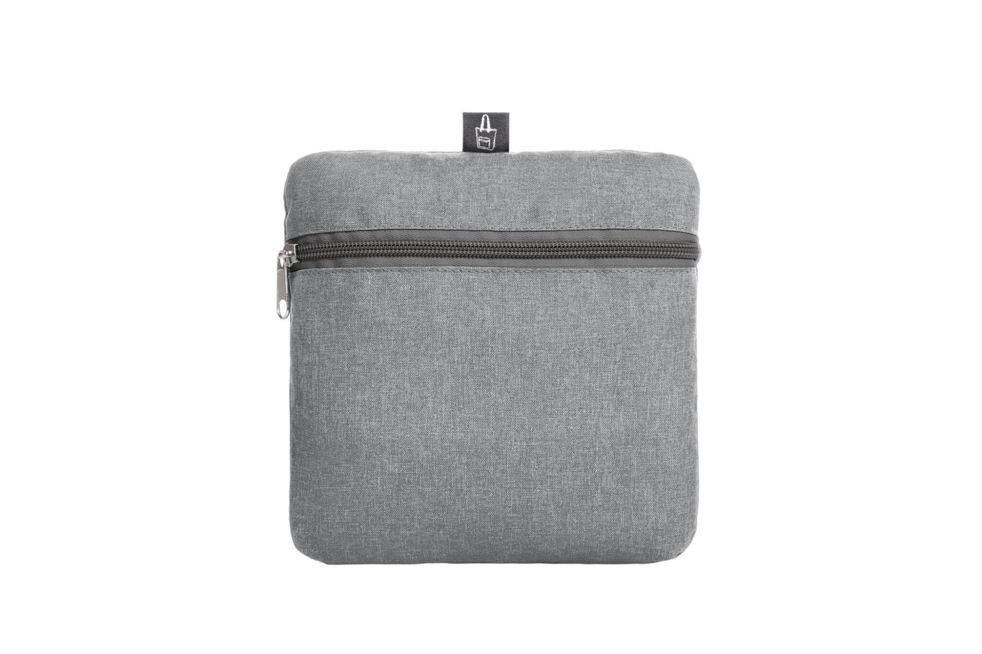 A grey tote bag with a zipper closure and a small branding logo on top.