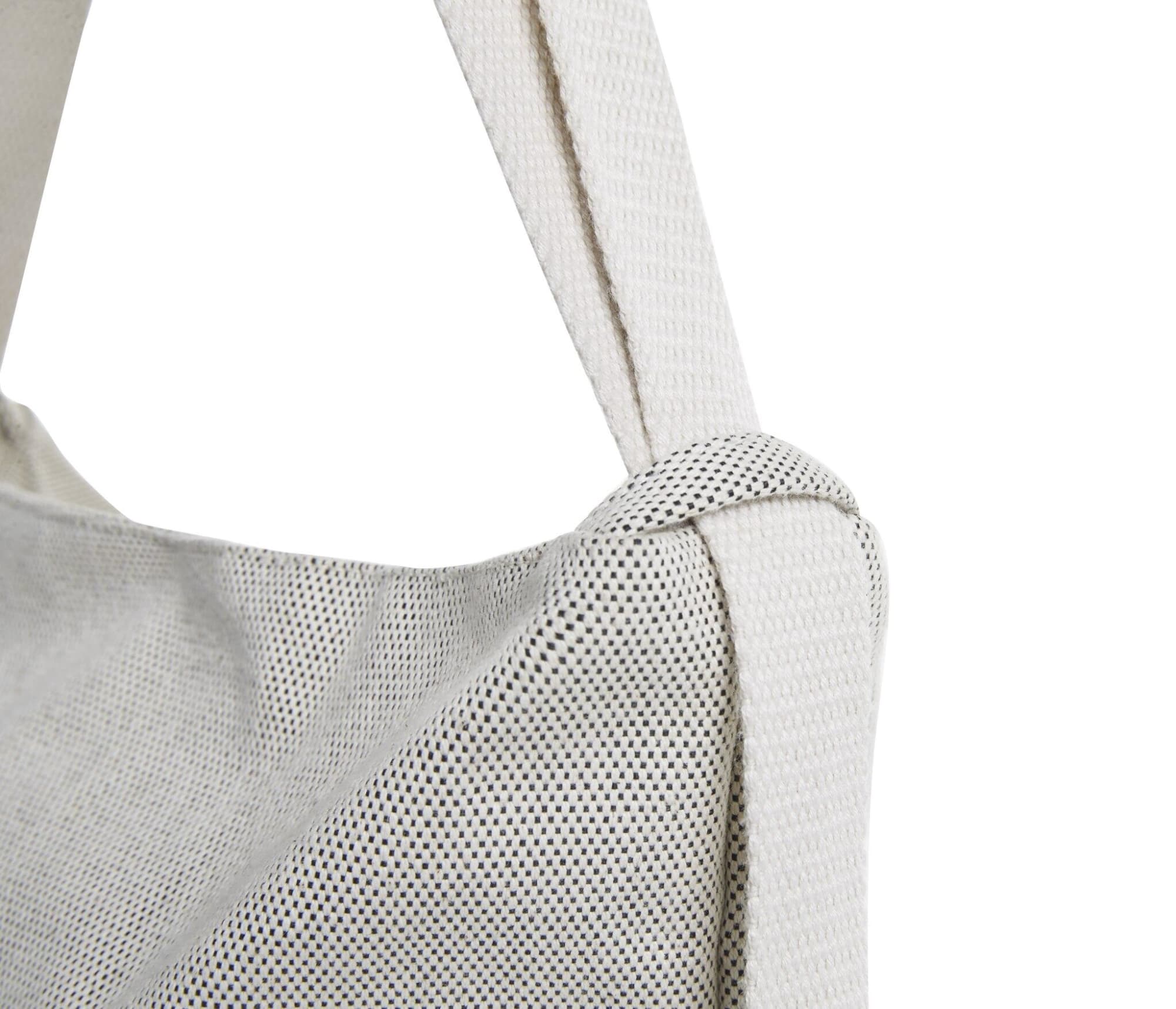 A multi-purpose bag in white with a textured surface and a sturdy strap, featuring a logo.