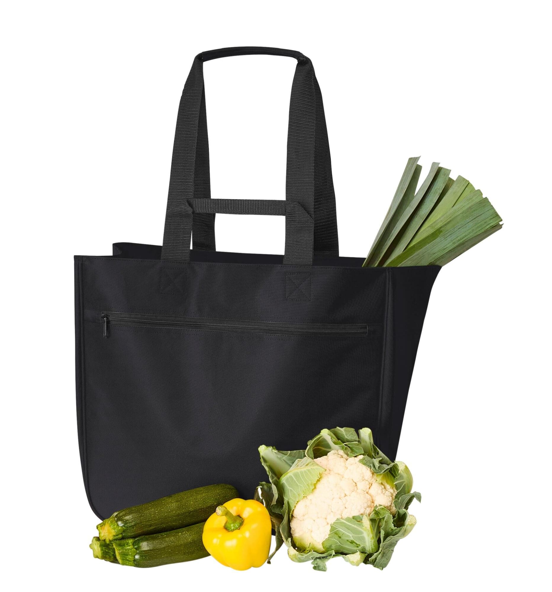 A black tote bag with long handles, containing zucchini, cauliflower, a yellow bell pepper, and leeks.