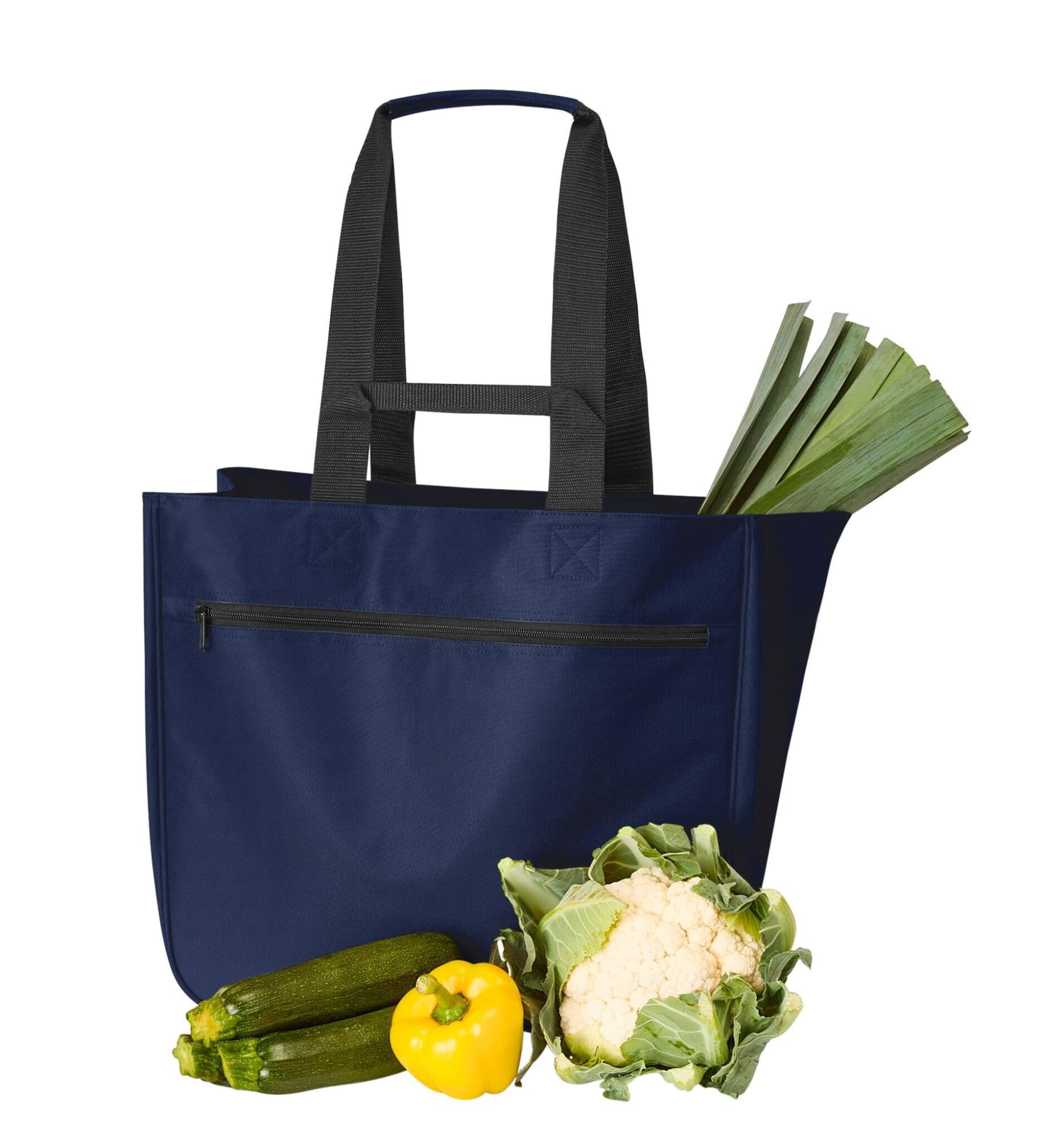 A navy blue tote bag with two handles, containing leeks, zucchini, cauliflower, and a yellow capsicum.
