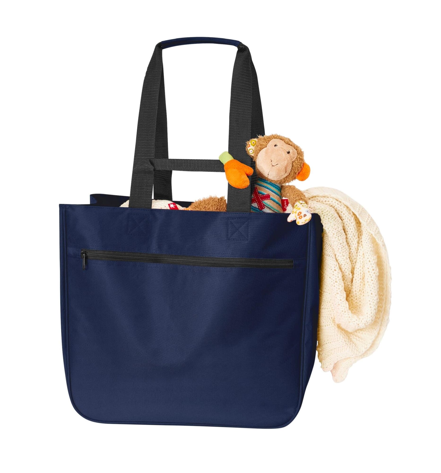 A navy Softbasket Shopper bag containing a soft blanket and a plush monkey toy, with a zipper pocket on the front.