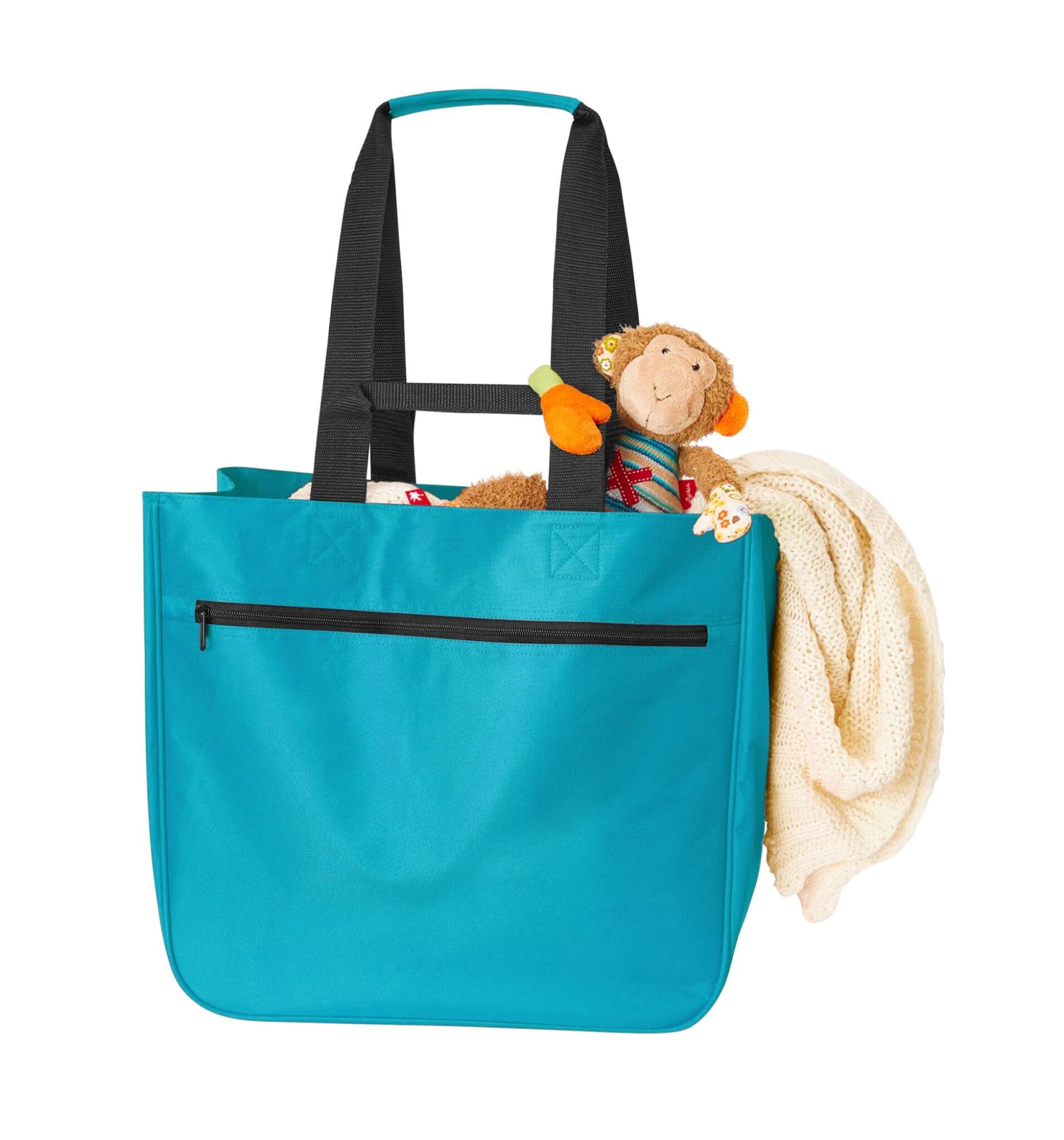 A turquoise tote bag with black straps, featuring a plush monkey toy and a cream blanket inside. It includes a zippered pocket.