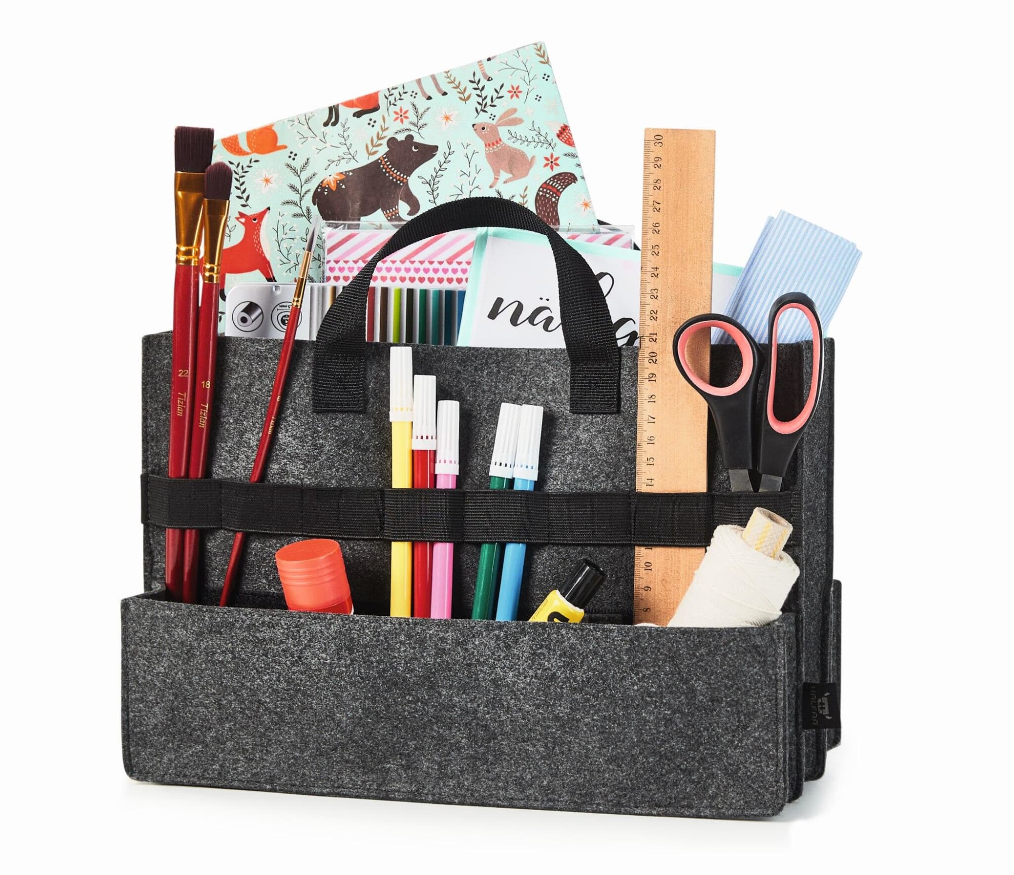 A grey felt organiser bag filled with stationery items, including scissors, markers, glue, and rulers.