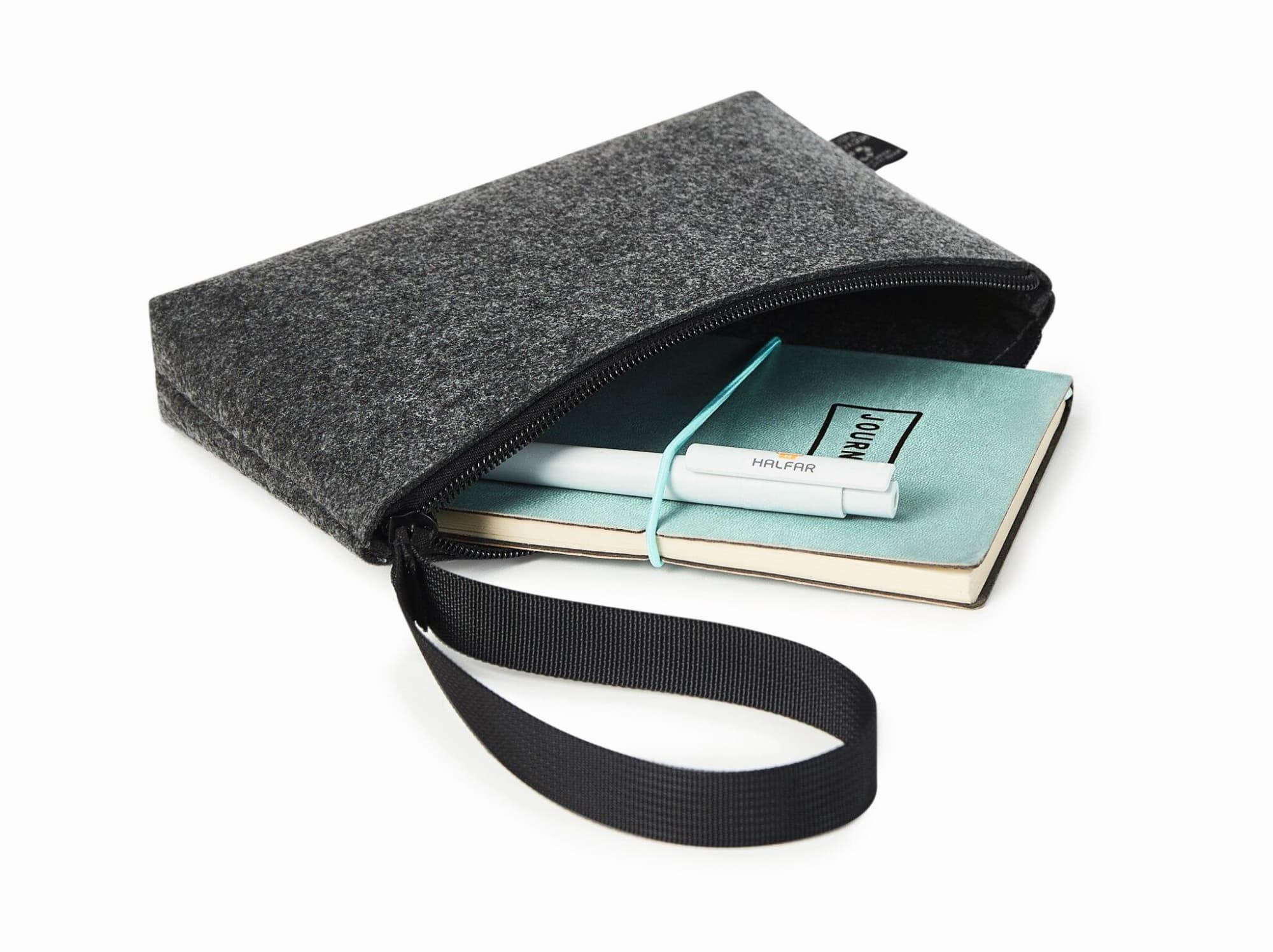A grey felt zipper bag contains a notebook and a pen, featuring a wrist strap for easy carrying.