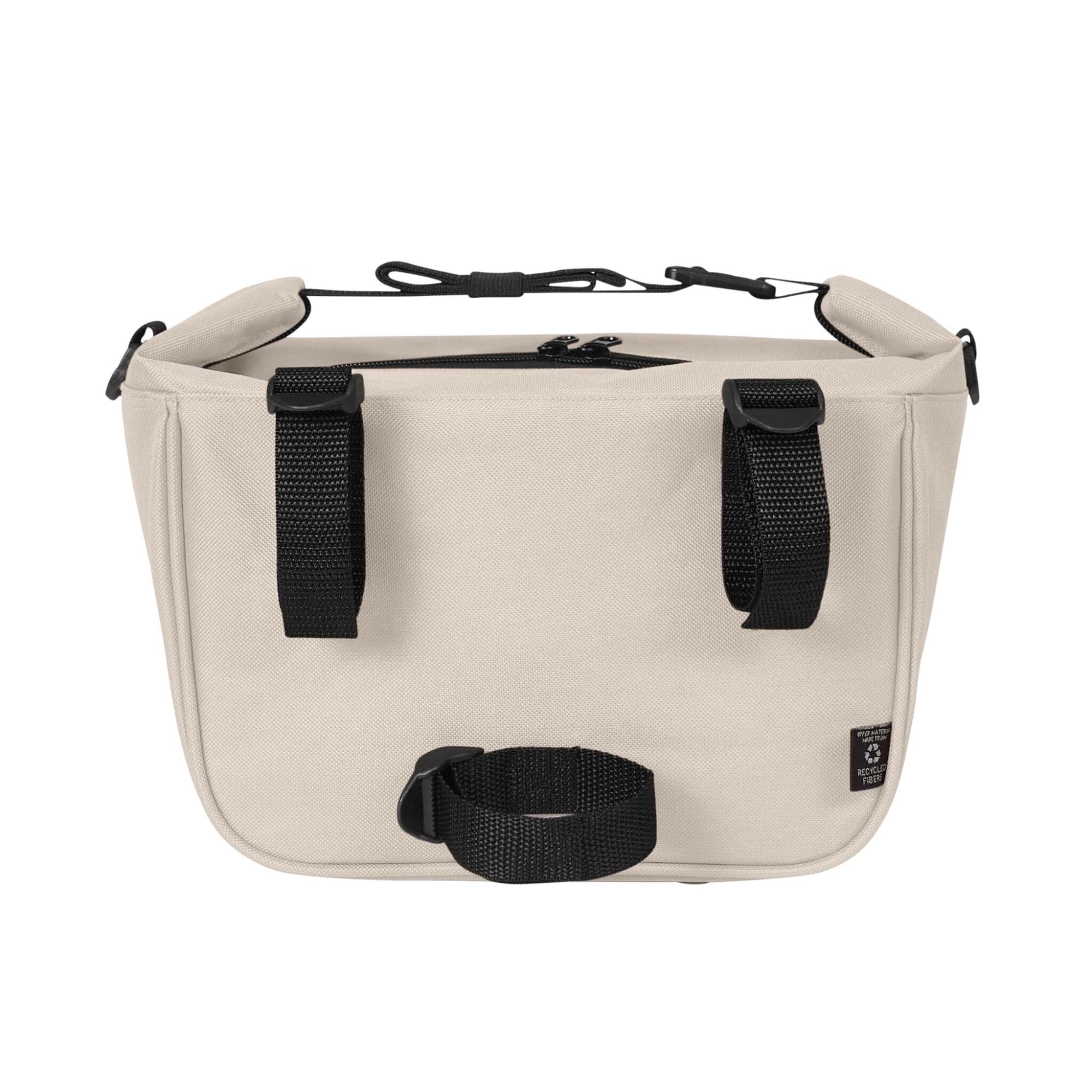 A beige lunch bag featuring black straps and a handle, with a zipper closure and branding on the side.