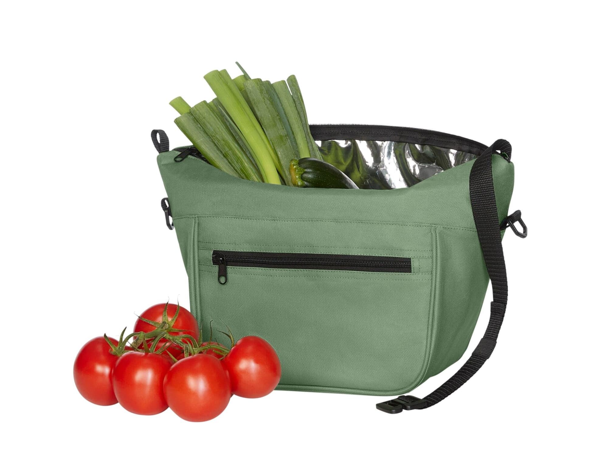 A green lunch bag filled with leeks and cucumbers, alongside a bunch of ripe red tomatoes. The bag features a zippered pocket and a logo.
