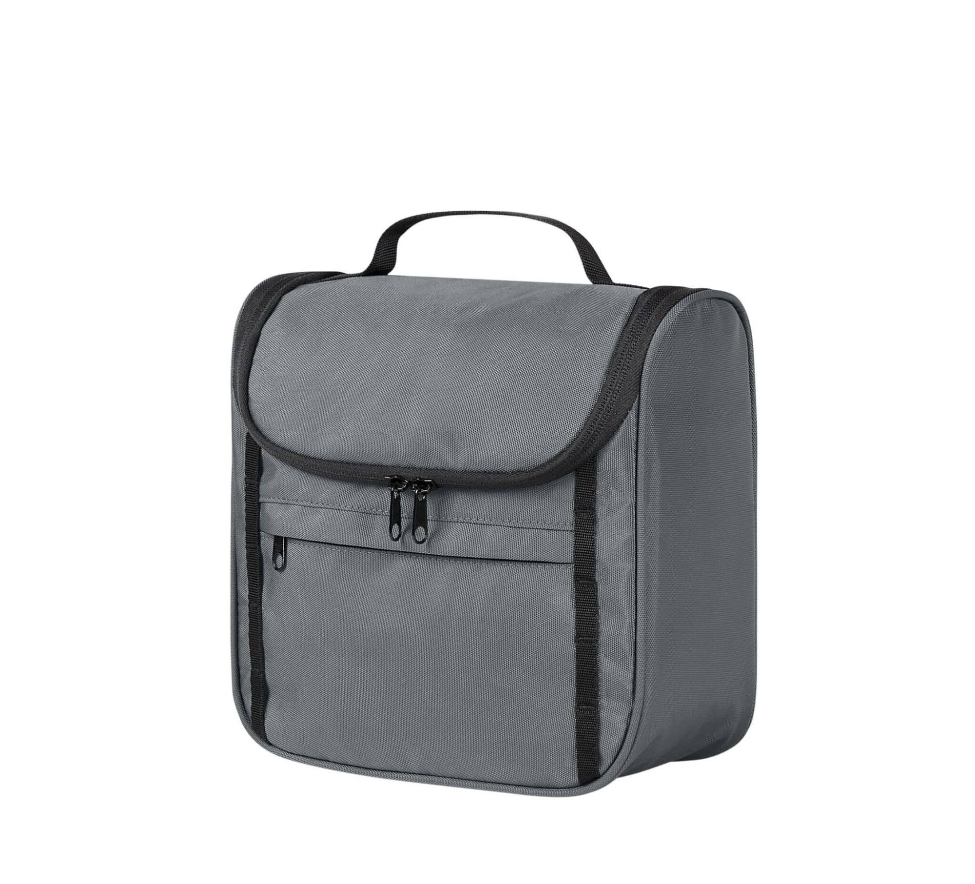 A grey toiletry bag with a zippered closure and a handle, featuring a front pocket and branding.