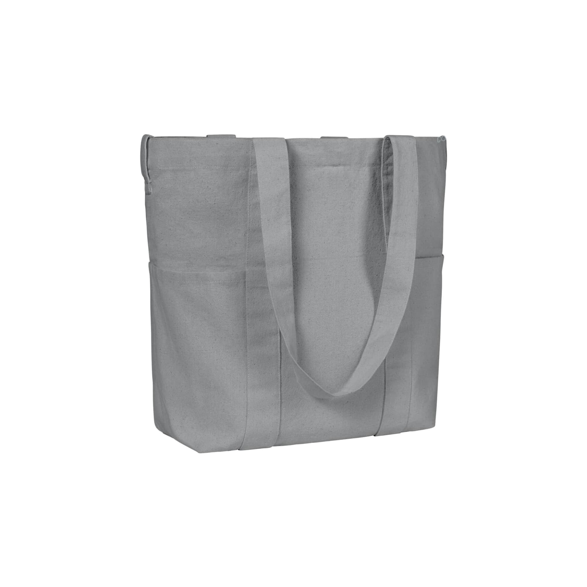 A grey organic tote bag featuring two side pockets and sturdy shoulder straps. It has a simple design with a logo.