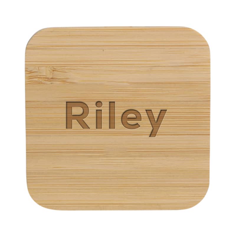 A bamboo wireless charger with a smooth, natural finish and rounded edges. It features a logo on the surface.