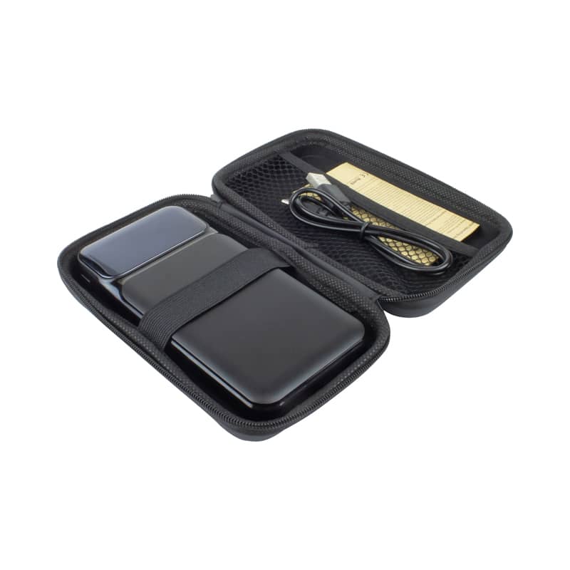 A black wireless power bank with a protective case and a charging cable inside.