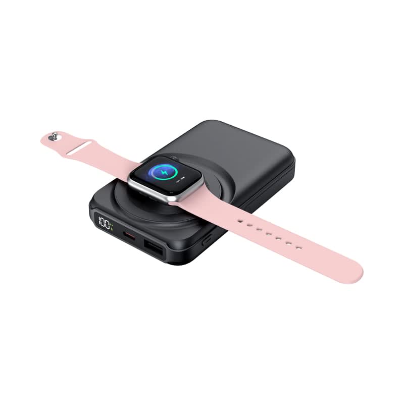 A black wireless power bank with a pink smartwatch resting on top, featuring a logo and multiple charging ports.