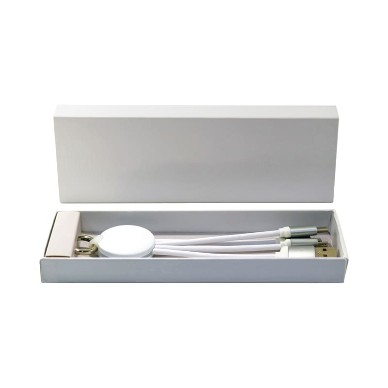A white gift box containing a charging cable and a round device, with a sleek design and a branding logo.