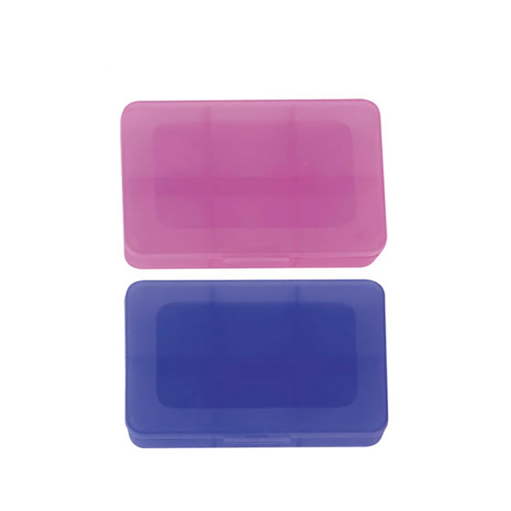 Two pill boxes, one pink and one blue, with a translucent design and a hinged lid. Each box features compartments inside.