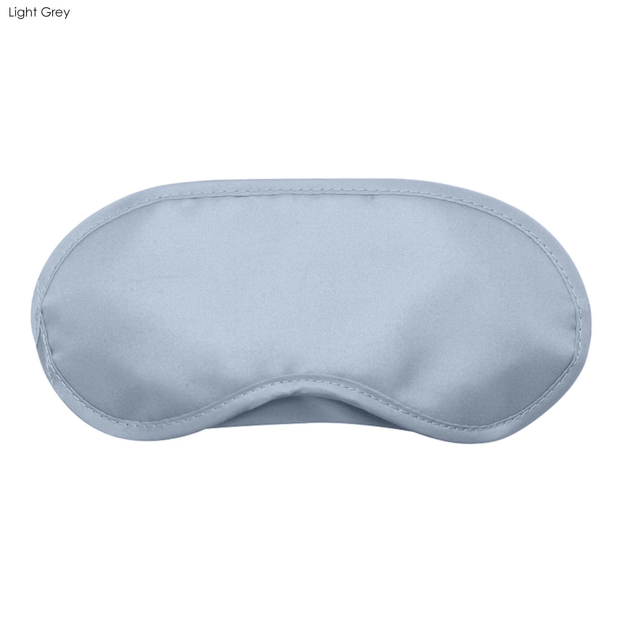 A light grey sleep eye mask with a smooth surface and curved shape, featuring a logo.