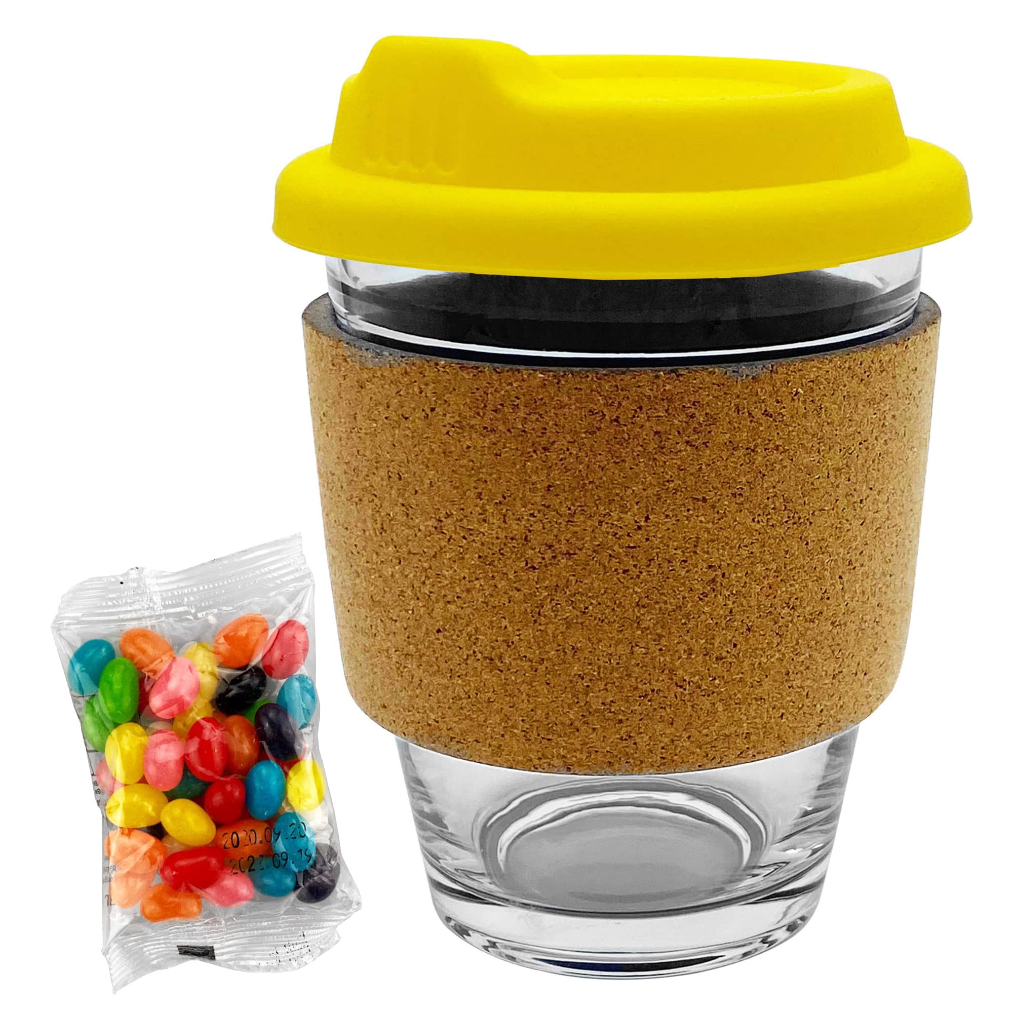 A glass coffee cup with a cork band and a yellow lid, accompanied by a pack of colourful jelly beans.