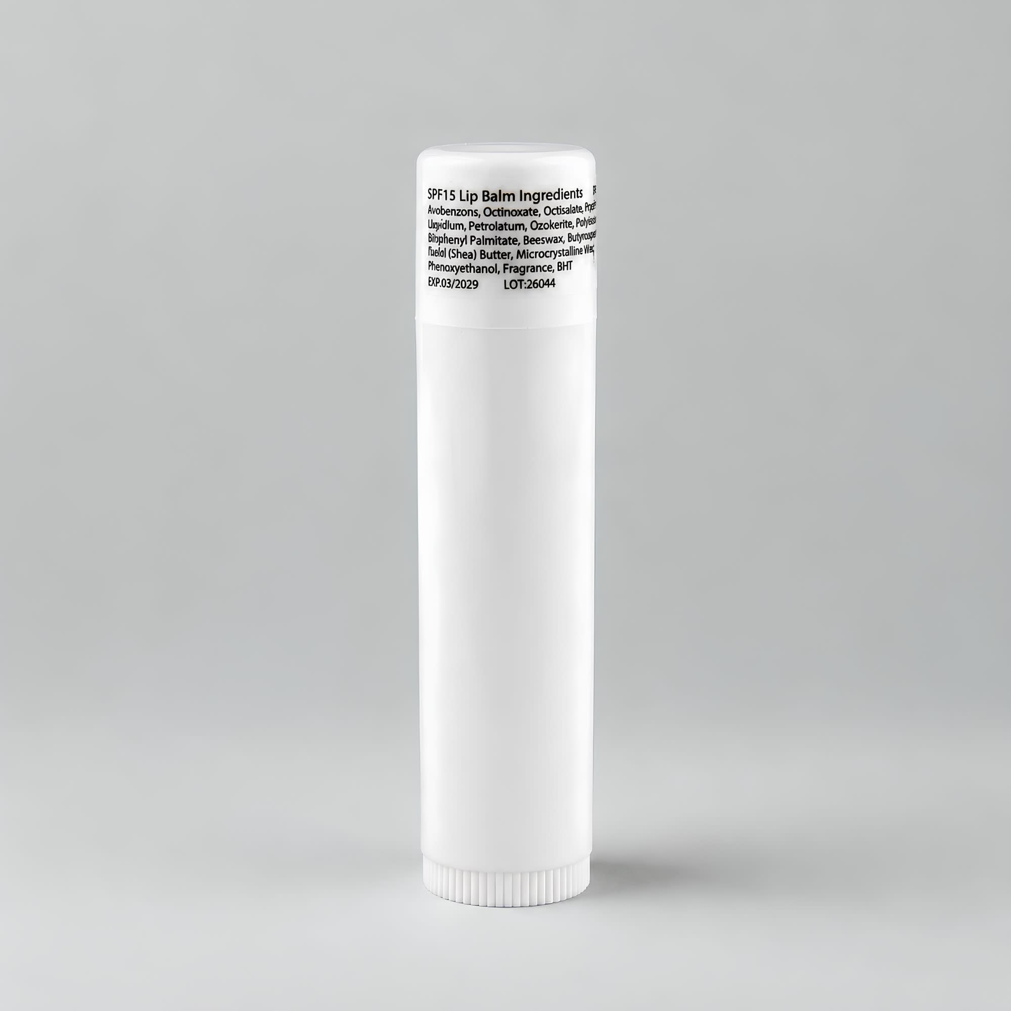 A white lip balm tube with a rounded cap, featuring ingredient information on the label.