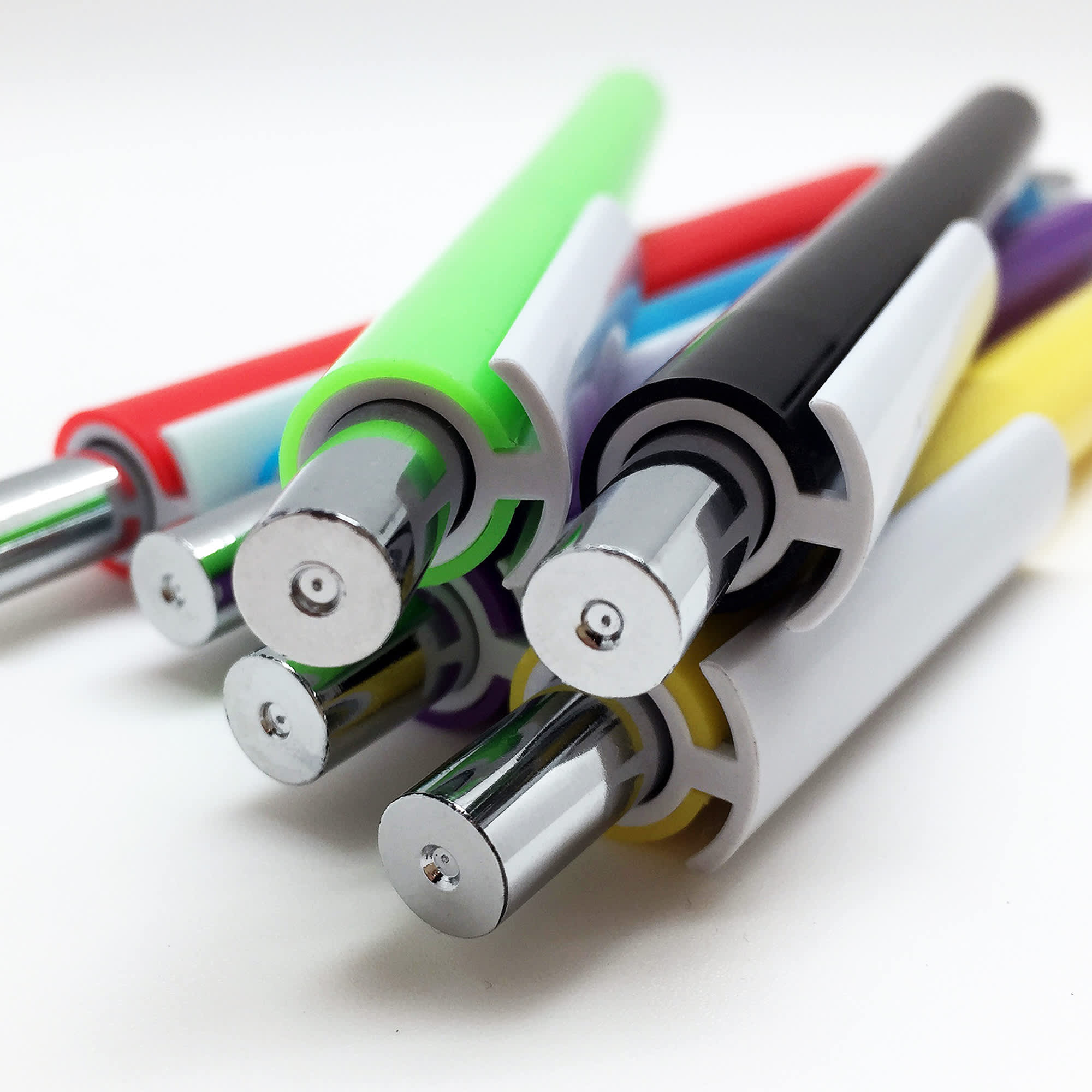 A collection of plastic pens in various colours, featuring chrome accents and a logo on each pen.