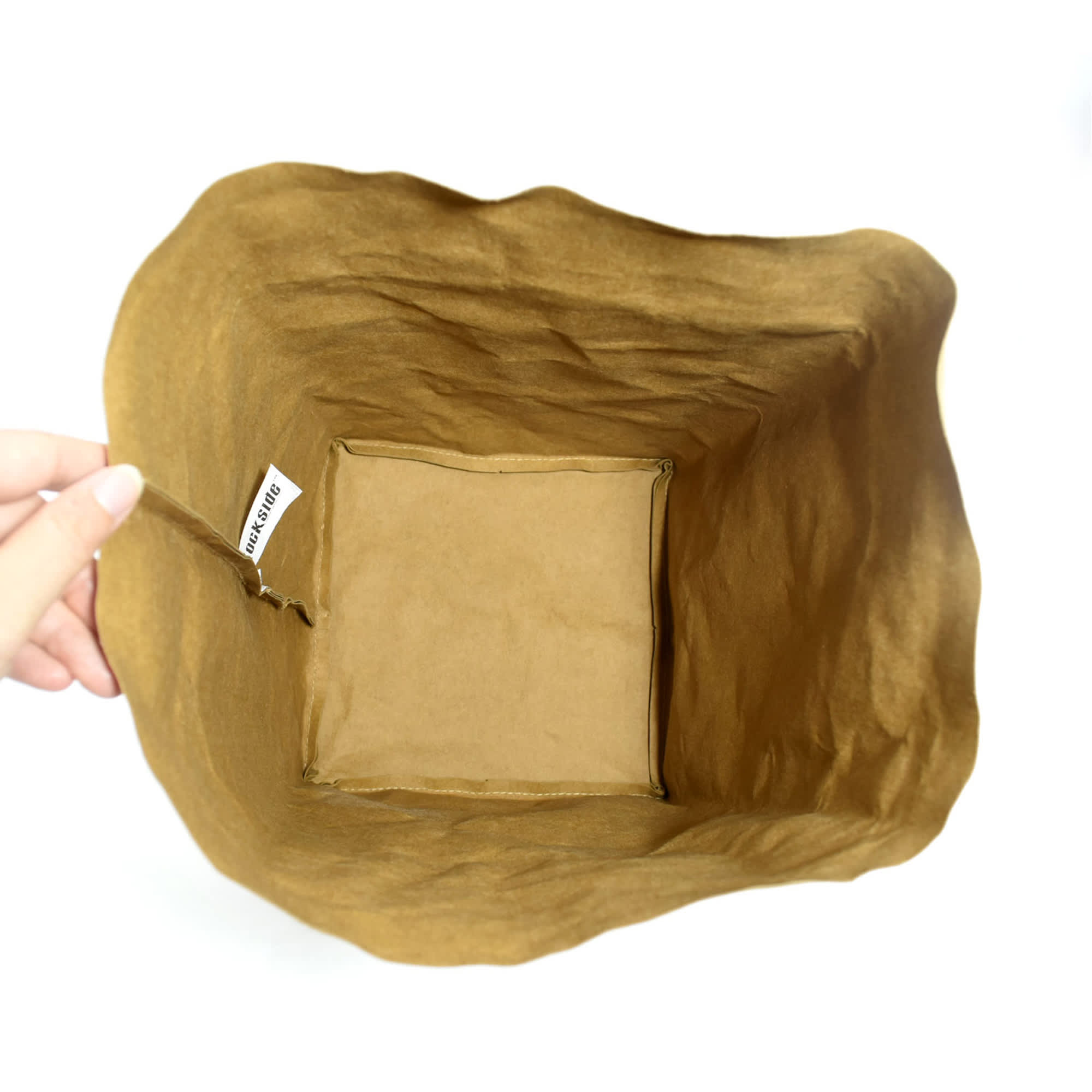 A large, brown Kraft paper storage bag with a soft, textured finish and an interior compartment.