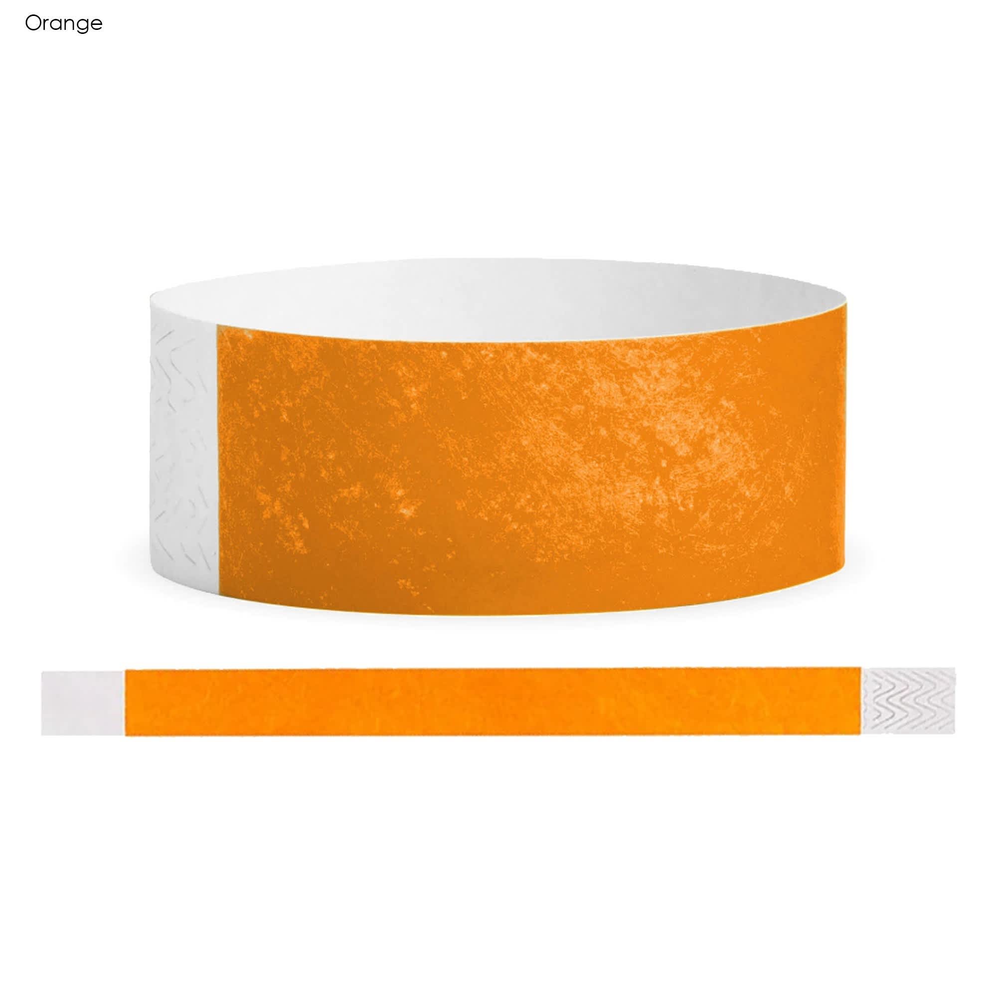 An orange Tyvek wristband with a textured surface and a white section for fastening.