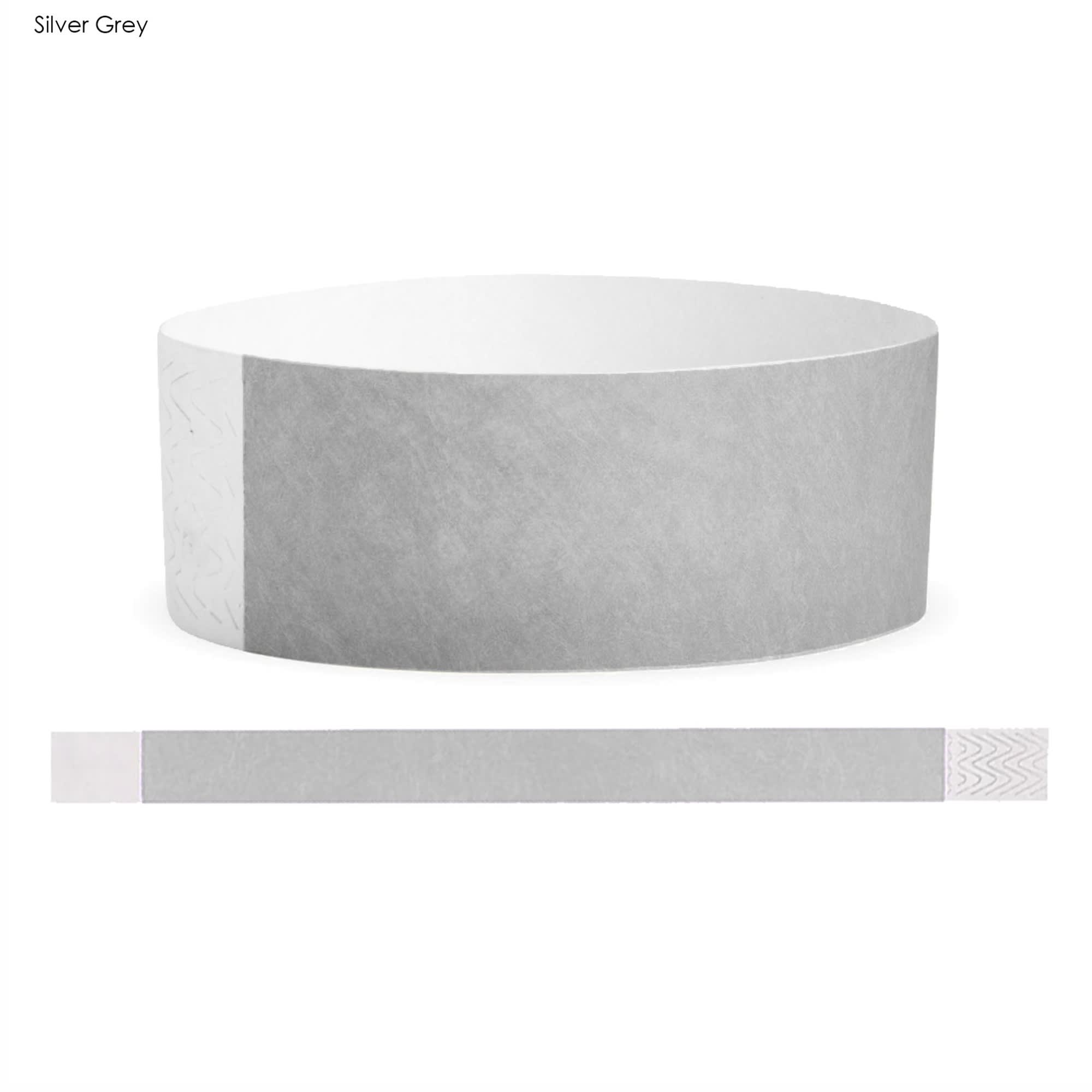 A silver grey Tyvek adult wristband with a smooth texture and integrated branding.