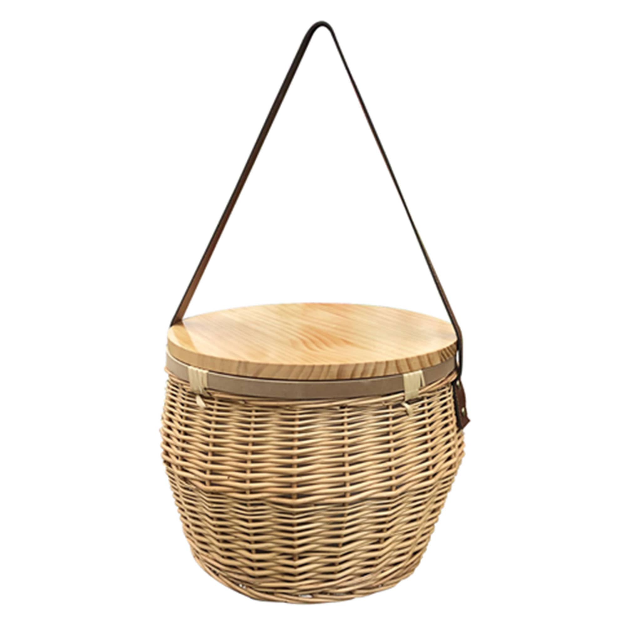 A round wicker picnic cooler basket with a wooden lid and a shoulder strap, showcasing natural tones.