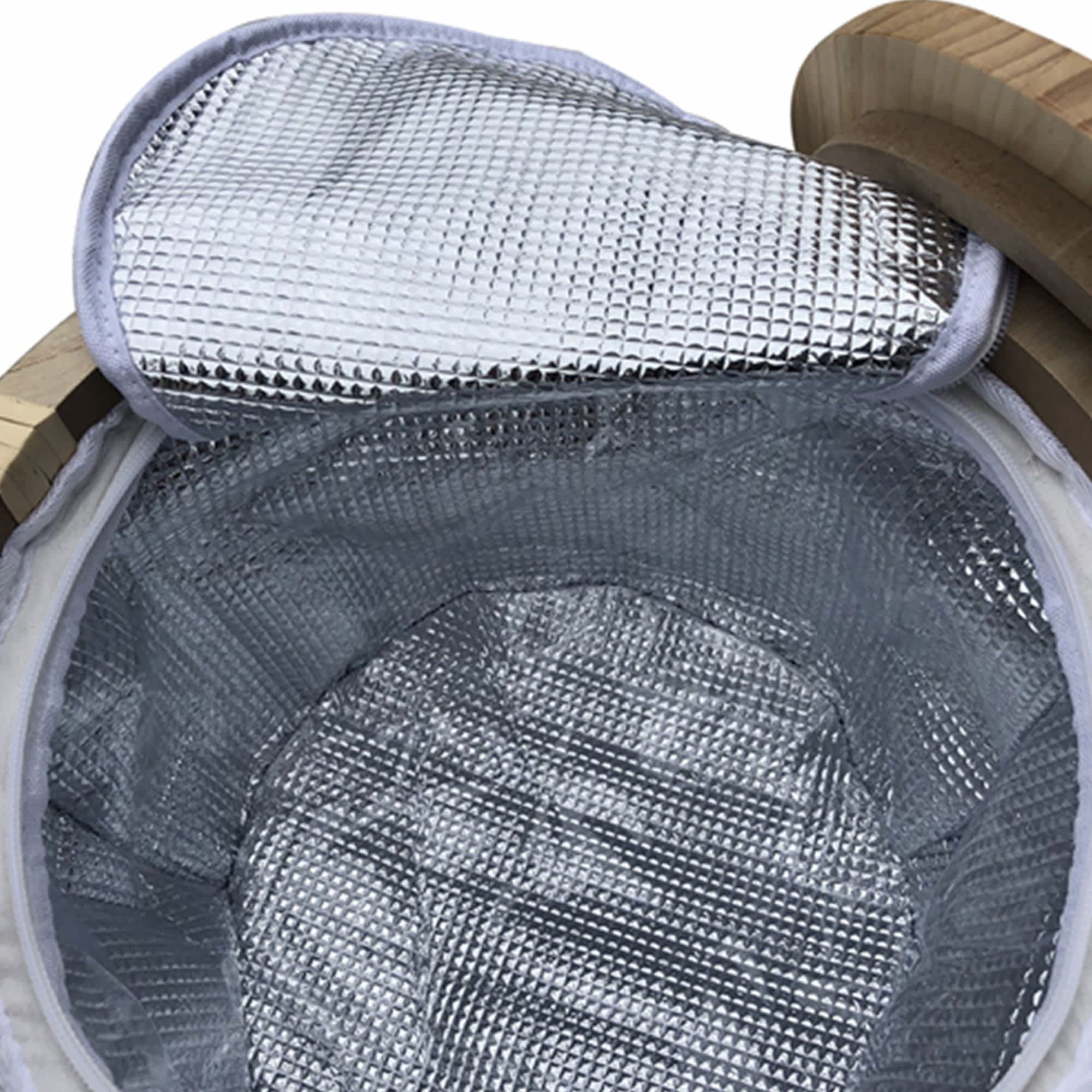 A round picnic cooler basket with a silver insulated interior and a wooden rim. It features a reflective lid.