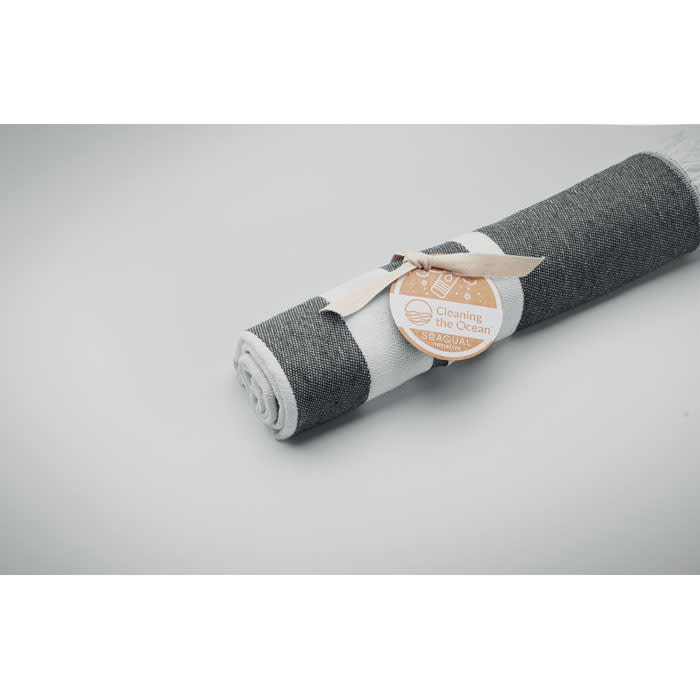 A rolled cleaning cloth in grey and white, secured with a ribbon and tag, featuring a logo.