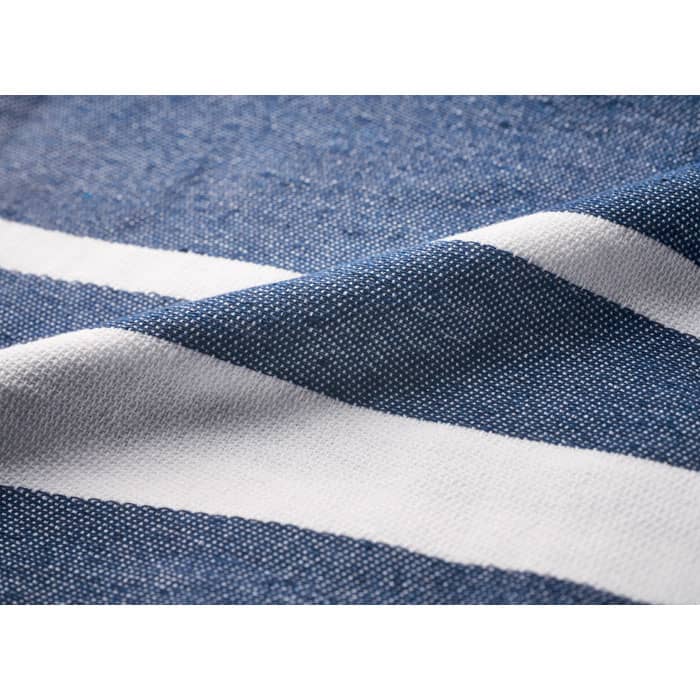 A close-up of fabric featuring a pattern of blue and white stripes.
