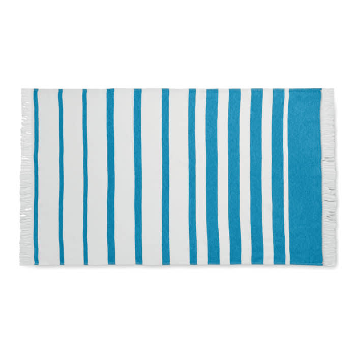 A beach towel featuring alternating blue and white stripes with fringing along the edges.