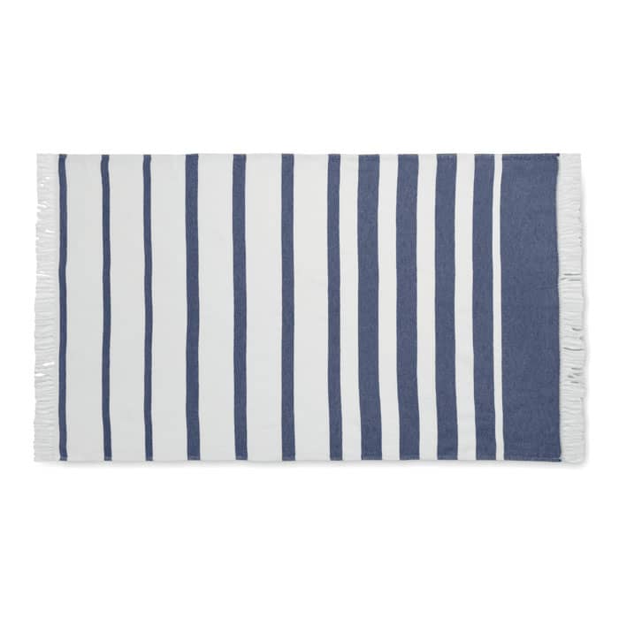 A striped towel featuring white and navy blue patterns, with fringe detailing at each end.