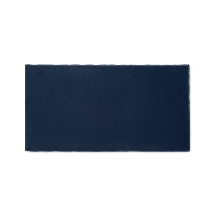 A rectangular mat in navy blue, featuring a textured surface and clean edges, with a branding logo.