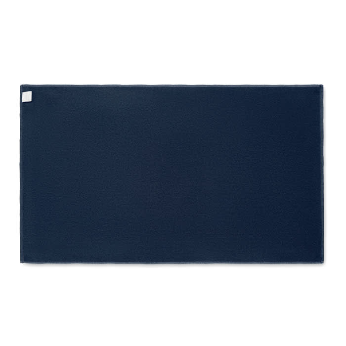 A navy blue mat with a textured surface and a small label in one corner.