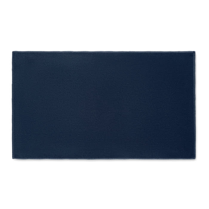 A rectangular navy blue mat with a textured surface, featuring a subtle logo in one corner.