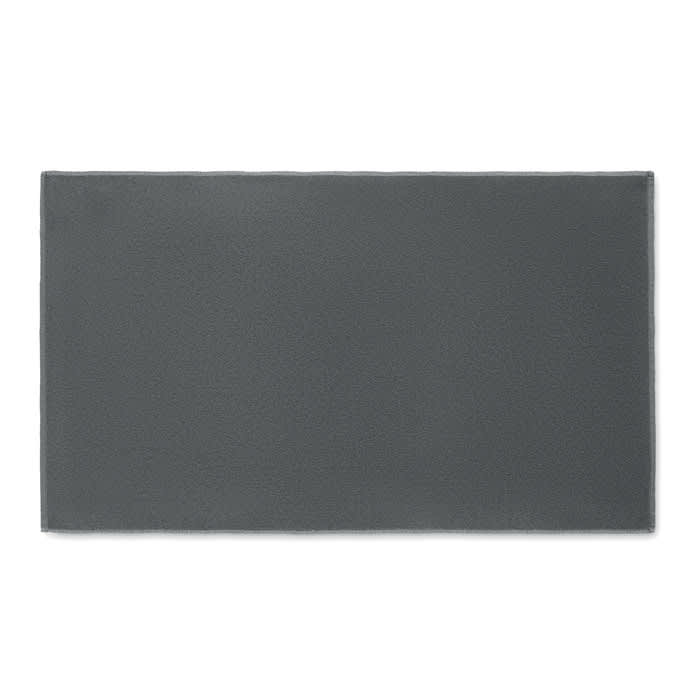 A rectangular grey mat with a textured surface, featuring a simple and minimalist design.