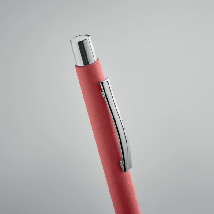 A pen with a vibrant red body and a shiny silver clip, featuring a sleek, modern design.