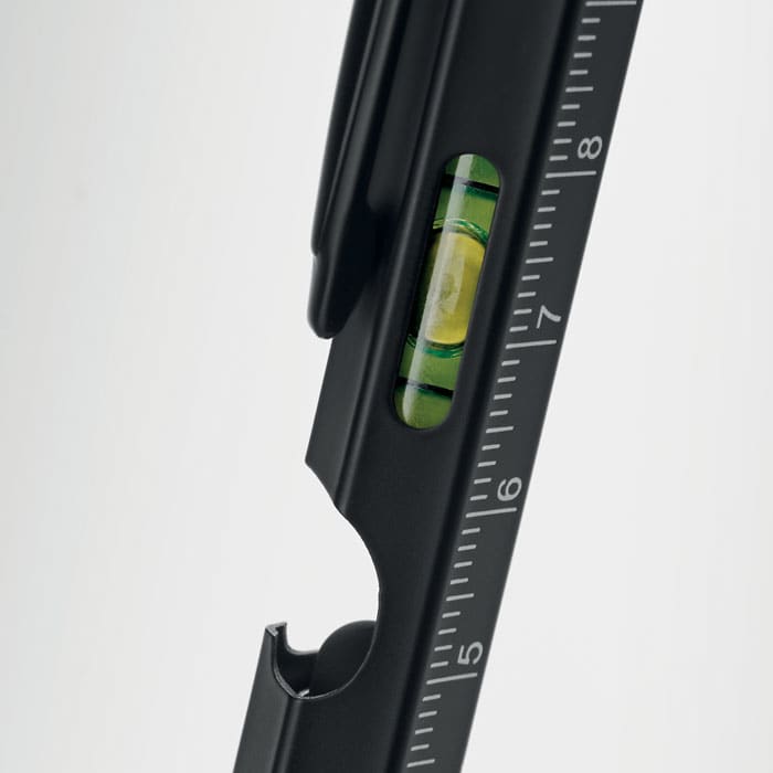 A black level tool featuring a built-in bubble level and measurement markings.