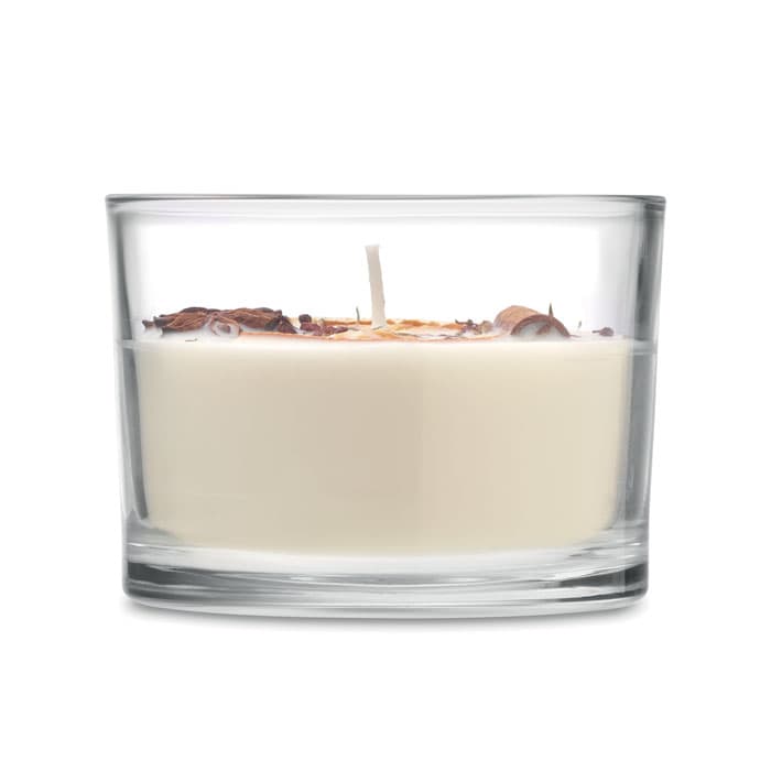 A candle in a clear glass holder, featuring a white wax interior and decorative elements on top.