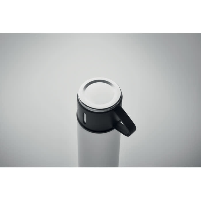 A drink bottle in white and black, featuring a black lid with a handle and a small opening for sipping.